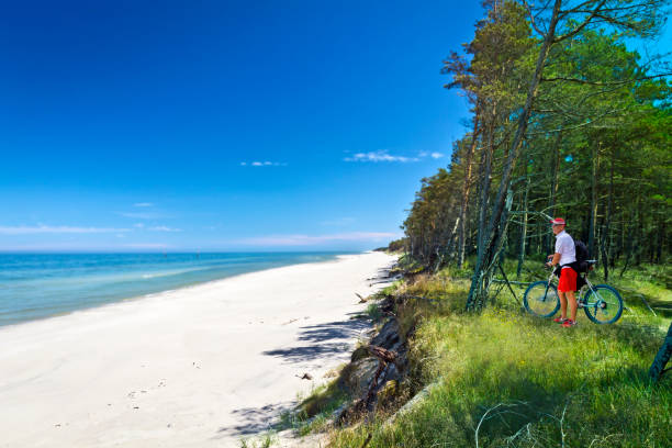 Summer holidays on the coast of the Baltic sea Holidays in Poland - summer recreation at the Baltic seashore in Stilo near Leba resort in Pomorskie province polish beach stock pictures, royalty-free photos & images