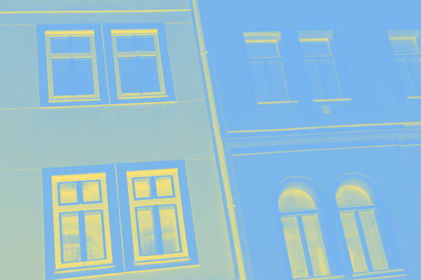 istock Light blue wall with yellow windows. Fragment, details. Toned photo 1226923292