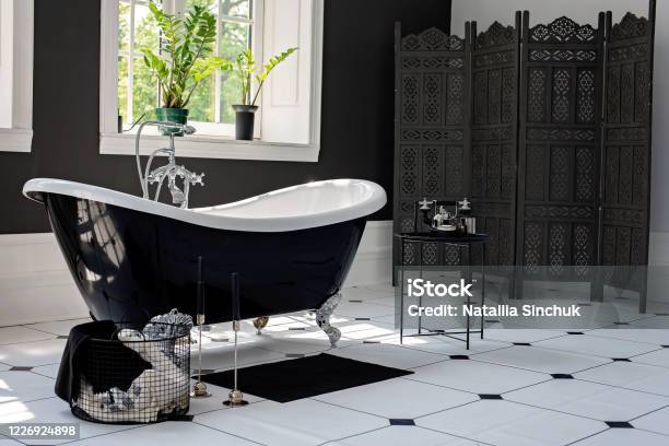Black And White Modern Bathroom With Silver Fittings With Large Sunny Windows Interior Design Concept Soft Selective Focus Stock Photo - Download Image Now