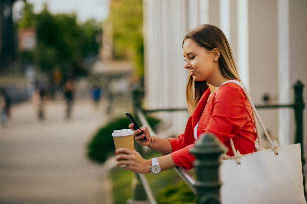 istock Woman using smartphone in the city 1226926256