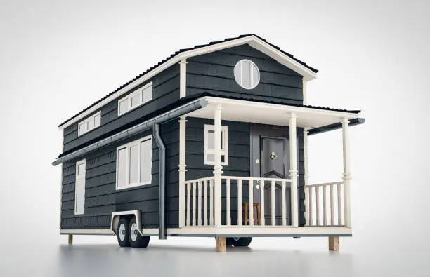 Photo of Concept of a mobile scandinavian tiny house isolated on white background. 3d rendering.