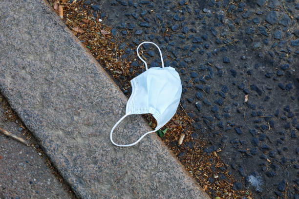istock Unhygienic disposal of protective face mask 1226929345