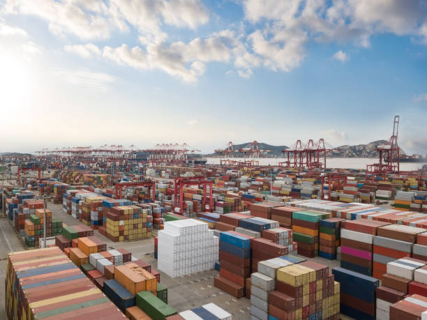 istock Logistics and transportation of Container Cargo ship and Cargo plane with working crane bridge in shipyard 1226930930
