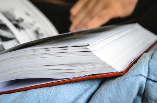 istock Book and hands of an elderly man, close-up 1226932283