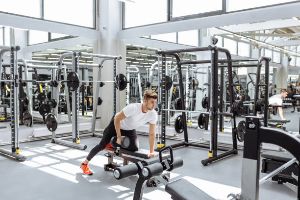 istock Strong man working with dumbbell in gym 1226933006