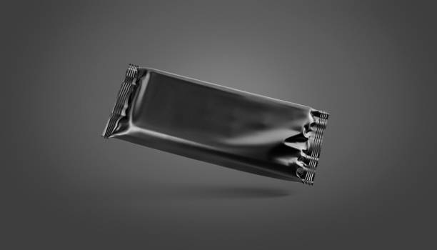 istock Blank black chocolate bar foil wrap mockup, dark background 1226934236