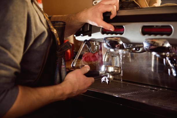 istock close up barista hand making a cup of coffee 1226934624