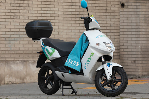 Madrid, Spain - May 19, 2020: Electric motorcycle of the shared system transport service from the eCooltra company, parked in O'donell street.