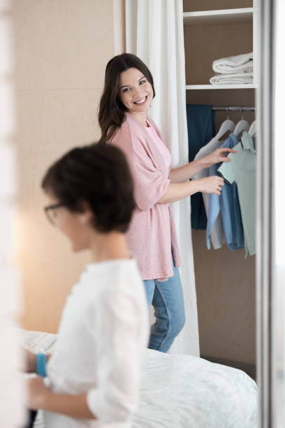 istock Smiling happy young woman looking at her son 1226936287