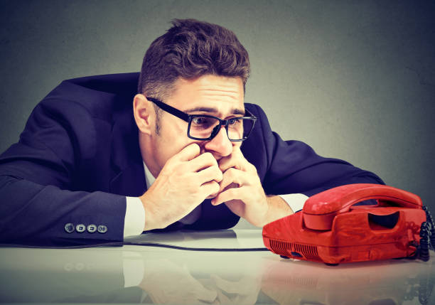 Desperate man waiting for someone to call him