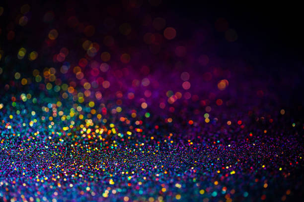 istock Shiny multicolor glitter raster background. Abstract shimmering pink, blue, yellow circles decorative backdrop. Bokeh lights effect illustration. Overlapping glowing and twinkling spots. 1226938228