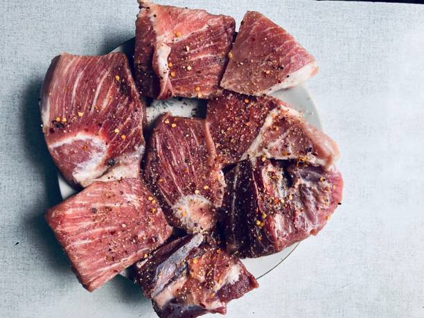 Photo of pieces of meat (pork) for further roasting, lying on a plate