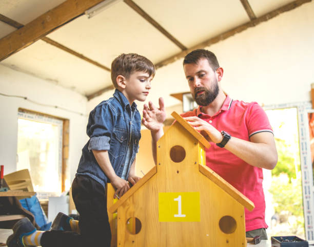 istock Father and Son Making a Birdhouse 1226939985