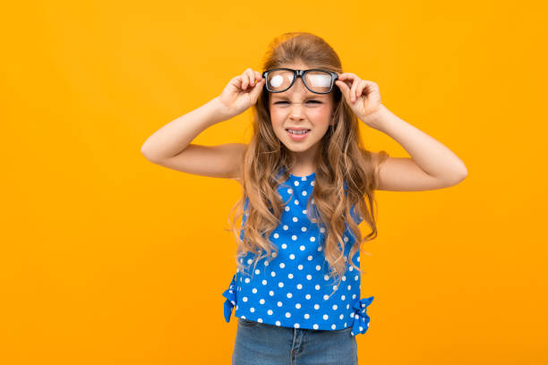 istock Nice little girl with her glasses isolated on white background 1226942645