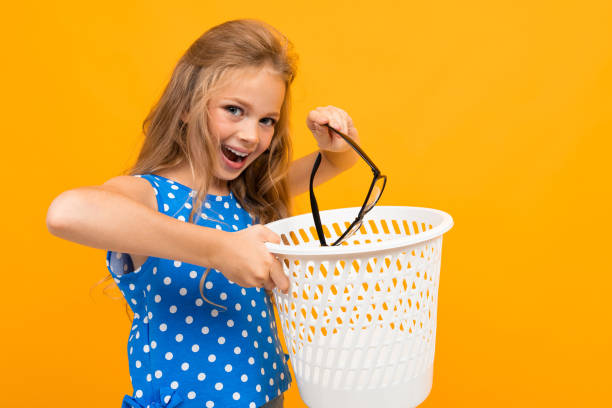 istock Nice little girl with her glasses isolated on white background 1226942970