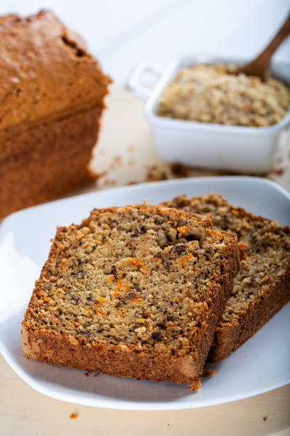 istock Sweet walnut carrot cake on white background 1226944815