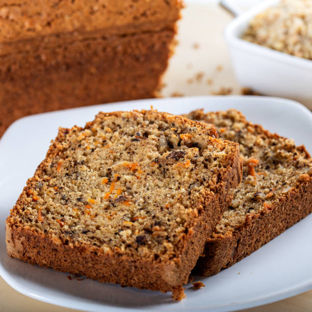 istock Sweet walnut carrot cake on white background 1226945304