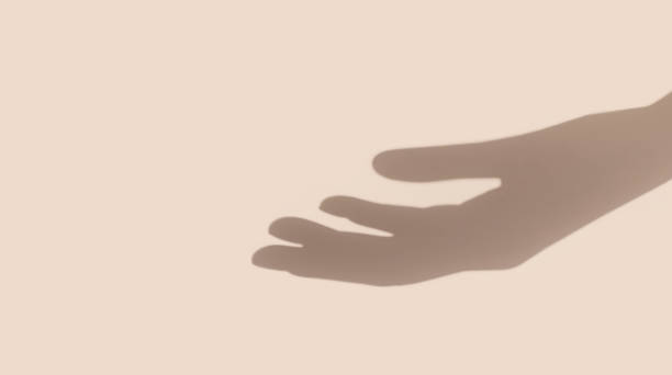 istock Hand shadow on nude beige background with copy space 1226945652