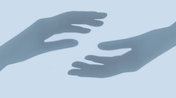 istock Two hands shadow on light blue background. Connecting and contact 1226945686