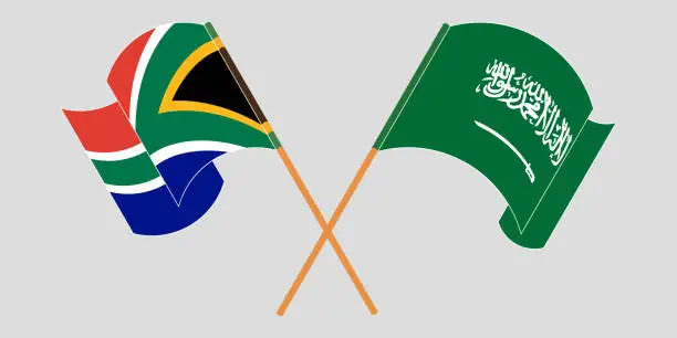 Vector illustration of Crossed and waving flags of South Africa and the Kingdom of Saudi Arabia