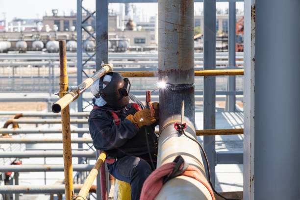istock Manual arc welding of pipelines on an open site 1226946716