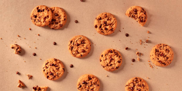 istock Chocolate chip cookies panorama on a brown background, overhead flat lay 1226946826