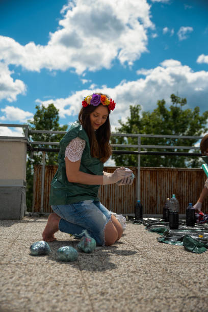 istock Young women making tie dye clothes on rooftop 1226947075
