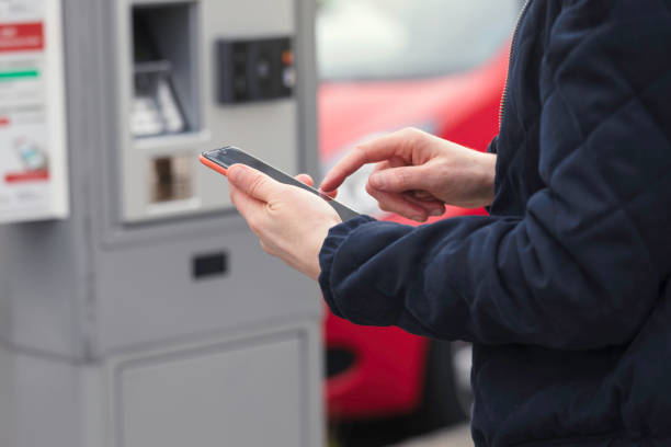 istock Person paying parking ticket with mobile phone 1226948568