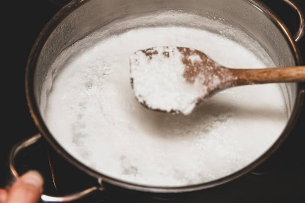 istock Fresh cheese making process, clotted cheese in a saucepan, homemade cotton, curd cheese or paneer 1226950968