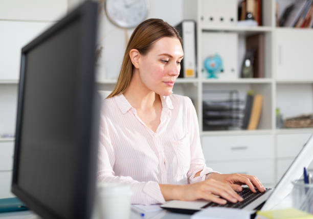 istock Young woman working at office alone 1226957178