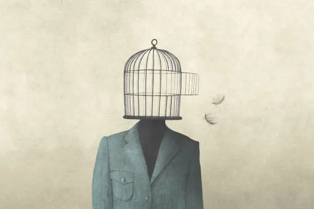 Photo of man with open birdcage over his head, surreal freedom concept