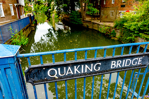 A metal pedestrian bridge on the River Thames near  an Oxford Gaol named Quaking Bridge because the prisoners would quake when led across it to prison.