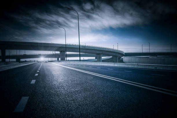 istock Clear blue sky and white clouds in the background, highway overpass curved approach bridge 1226960633