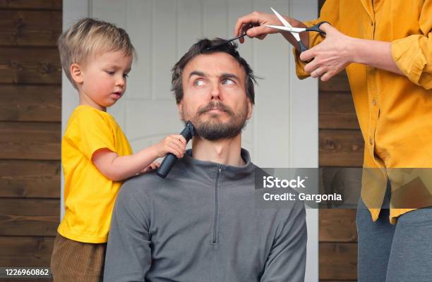 Family Haircut At Home During Quarantine Lockdown When Closed All Hairdressers Mother Cutting Hair To Father Family Haircut At Home During Quarantine Lockdown When Closed All Hairdressers Mother Cutting Hair To Father