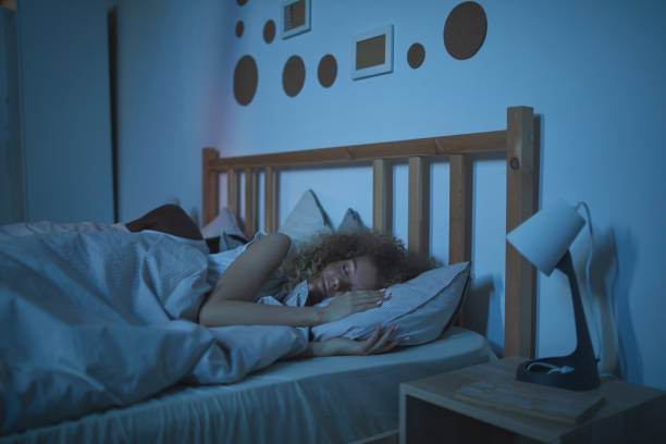 istock Couple Sleeping in Bed at Night 1226961664