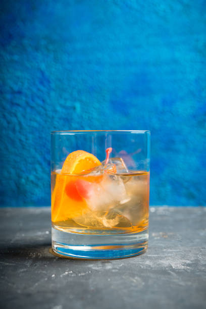 istock Old fashioned beverage with orange slices on rustic background 1226961827