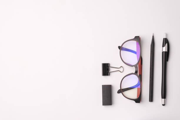 istock top view pen eye glasses on white background 1226966917