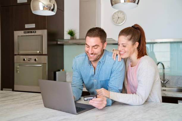 istock Couple doing online shopping at home 1226968772