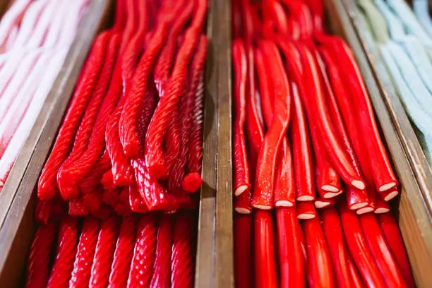 Photo of close up view of red candies in a market