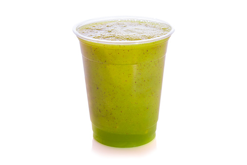 Kiwi smoothie in plastic cup isolated on white background.