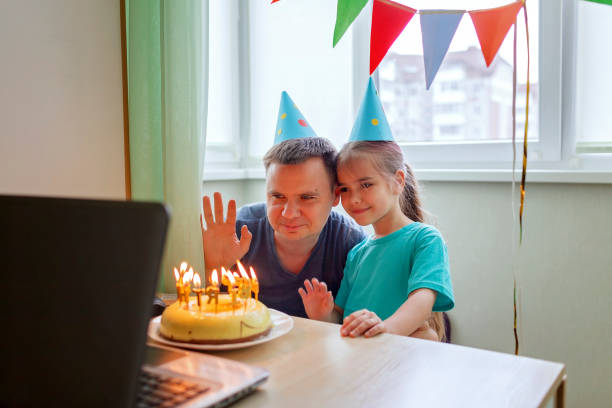 istock Happy father with two sibling celebrating birthday via internet in quarantine time, self-isolation 1226970116