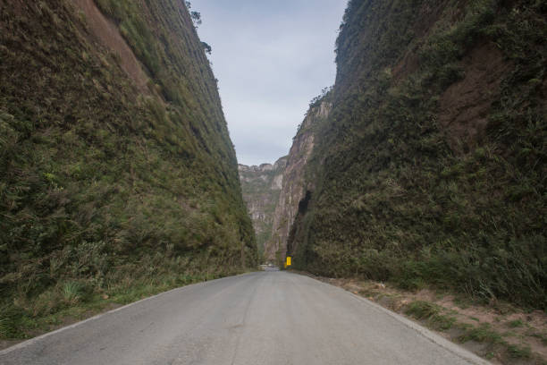 Urubici, Santa Catarina, Brazil - May 21, 2020:  Giant cliffs taken by native vegetation along the Serra do Corvo Branco road, one of the most dangerous roads of Santa Catarina State
