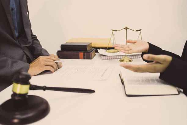 istock lawyer is explaining the method of winning the client's case. 1226976212
