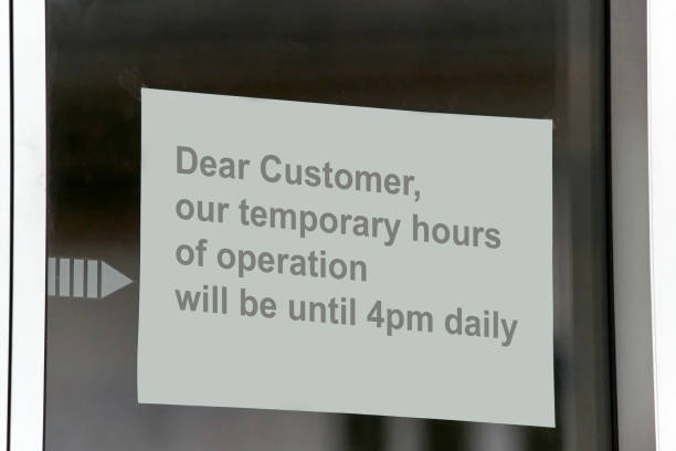 istock Signage to inform about reduced opening hours. 1226976656