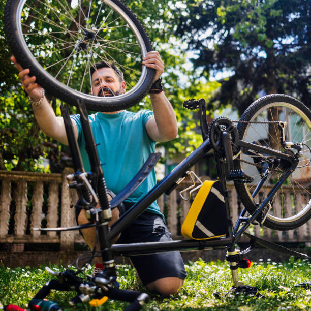 istock Man repairing bicycle DIY 1226980467