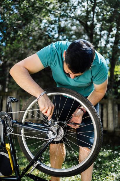 istock Man repairing bicycle DIY 1226980490