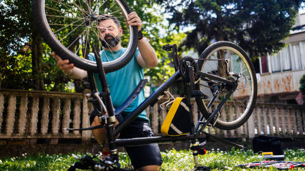 istock Man repairing bicycle DIY 1226980654