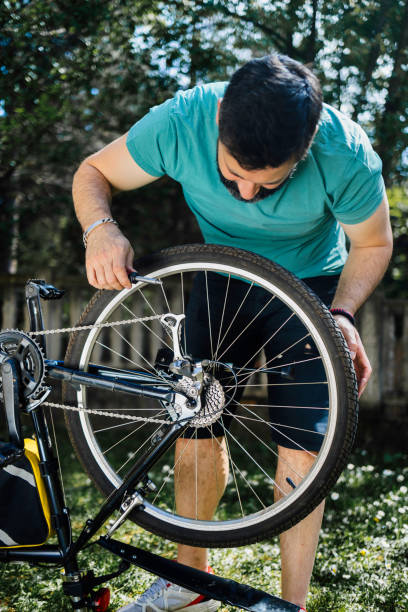 istock Man repairing bicycle DIY 1226980796