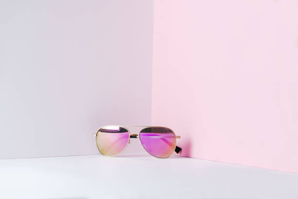 istock Stylish pink aviator sunglasses on modern minimal background, front view. Nobody 1226982093