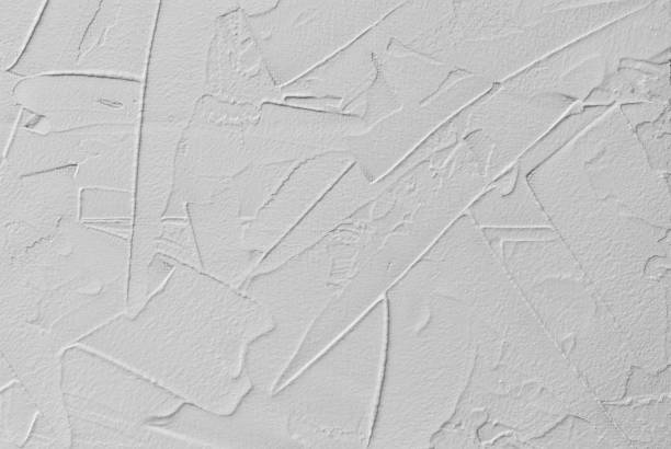 white abstract background of paste filler and bonding plaster with irregular dashes and strokes